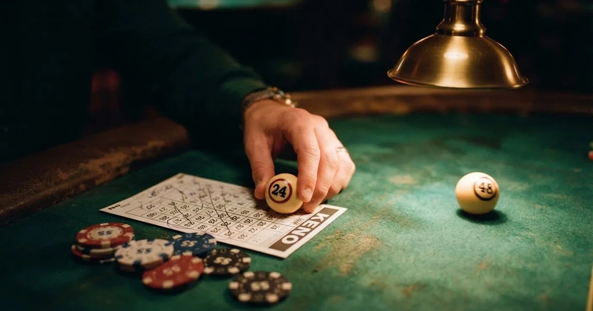 A close-up of a green felt gaming table with cards and chips mid-hand.